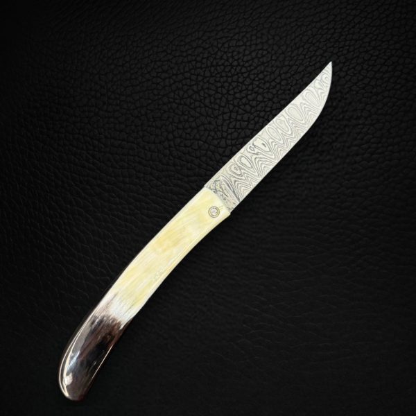 Couteau pliant corne de vache vosgienne laiton